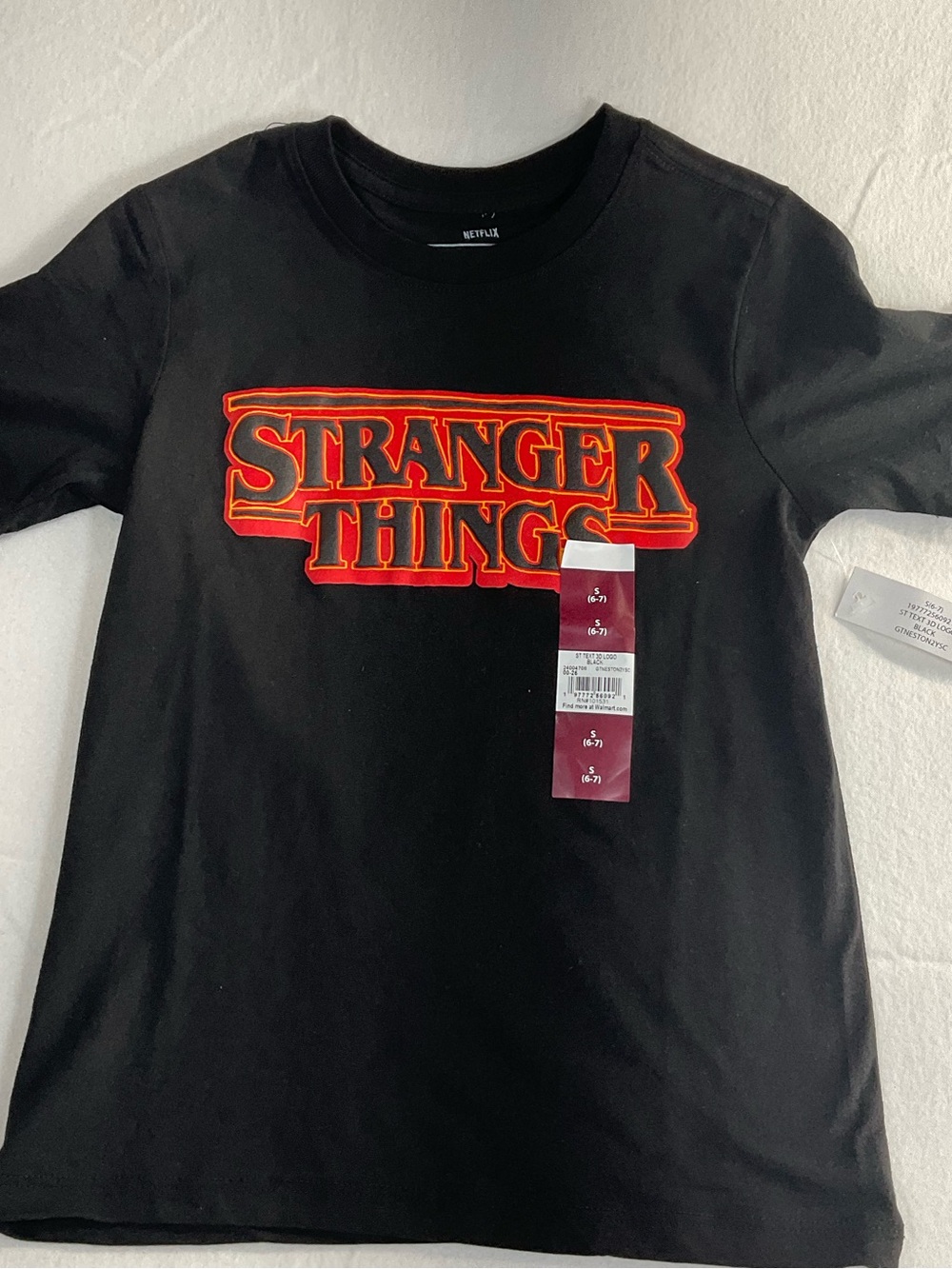 Netflix Black "Stranger Things" Logo Tee with Red and Orange Trim. Size S (6-7)